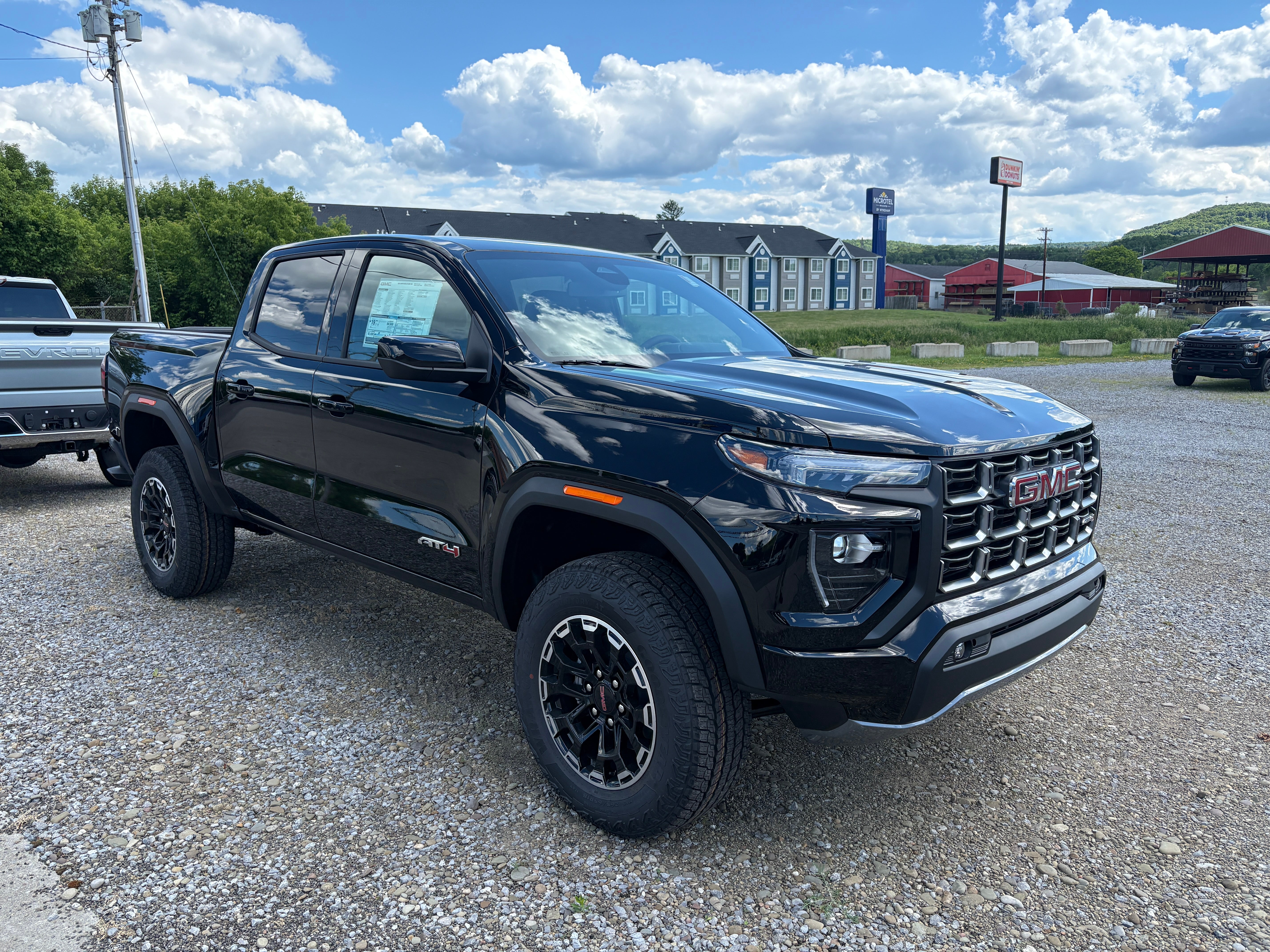 2026 GMC Canyon AT4 in Onyx Black — front three-quarter view